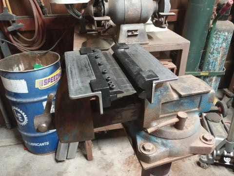6 Inch Magnetic Vise Mount Metal Brake Bender for DIY metalworking and small box fabrication, installed on a workbench in a garage.