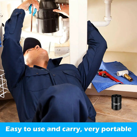 Plumber using heavy duty deburring tool for copper and PVC pipes, visible on the floor next to other tools, black metal casing.
