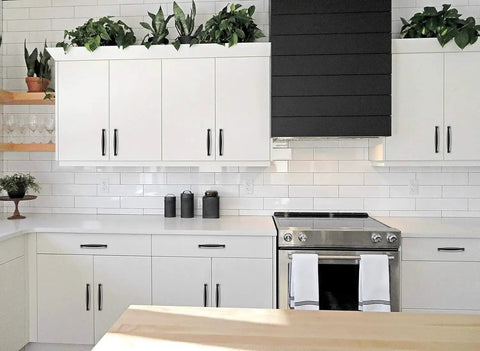 Modern kitchen with white cabinets featuring the 30 Pack 5 Inch Matte Black Cabinet Handles For Kitchen Cupboard And Drawer Pulls Hardware