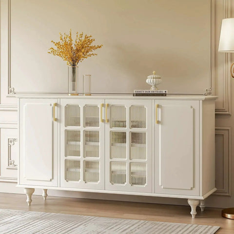 White cabinet with glass doors and gold cabinet pulls, featuring a brushed brass finish with safe rounded corners, in an elegant room.