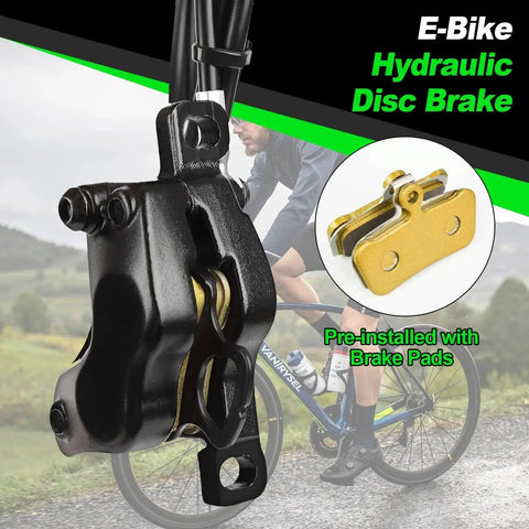 Black four-piston e-bike hydraulic disc brake caliper with pre-installed gold brake pads