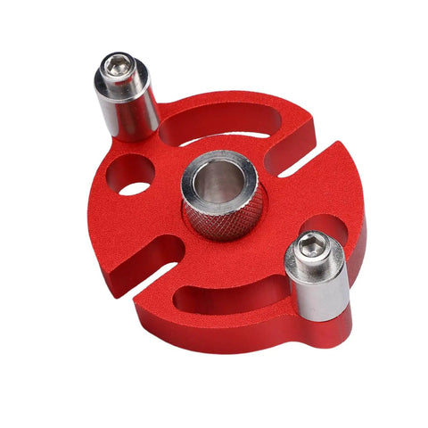 Red aluminum alloy self centering doweling jig for woodworking and furniture assembly, with 3 stainless steel drill bushings visible