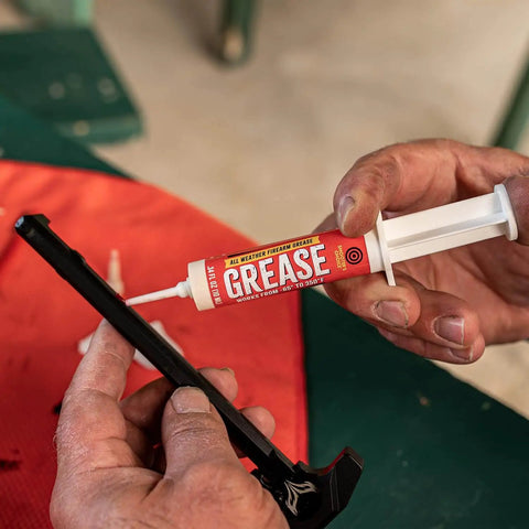 All Weather Synthetic Grease For Firearms High Tech Lubricant That Clings In Extreme Heat Or Cold 10cc syringe in use