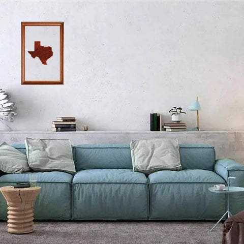 Living room with a blue sofa, wood art depicting Texas on the wall above, showcasing the use of United States Router Template Set Clear Acrylic Inlay Template For Woodworking State Map Jig For Tracing Crafting And Inlay Guides Reusable Durable Template For Texas And Other States.