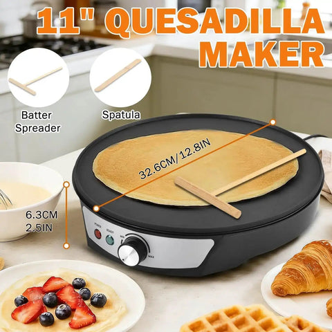 11-inch quesadilla maker with crepe batter spreader and spatula on a kitchen counter with pancakes and waffles