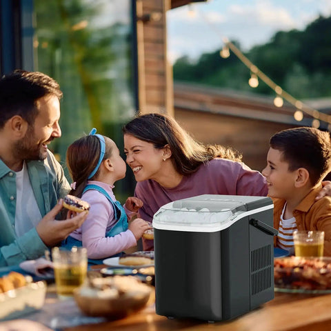 Portable Countertop Ice Maker With Handle 9 Cube Ice In 6 Minutes Auto Clean on outdoor table with family enjoying meal
