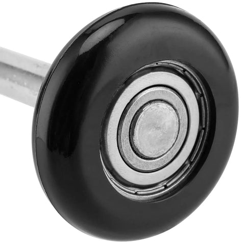 Close-up of a black nylon garage door roller, 1.8-inch diameter, showing the bearing for smooth operation in garages and warehouses.
