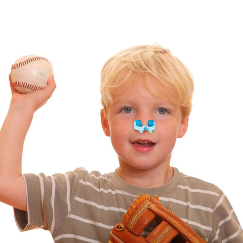Child with baseball wearing 16 Piece Nose Clip Set For Nosebleed Prevention Epistaxis Stopper Nasal Clip for emergency care.