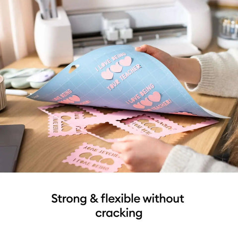 Person using Four Piece Cutting Mat Variety Pack For Cricut Explore And Maker Machines 12 By 12 Inches for crafting projects.