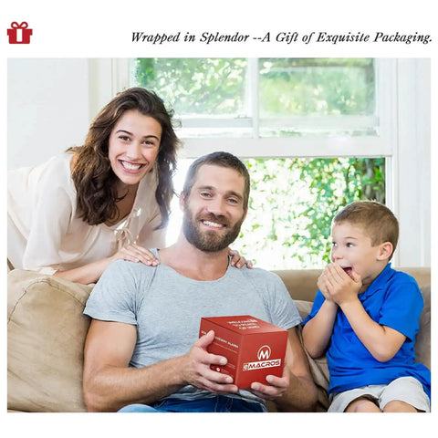 Family smiling with man holding wrapped gift box indoors