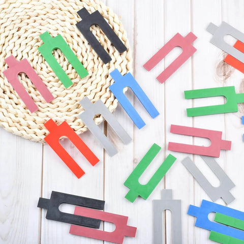 Pro Grade Leveling And Spacing Shims Kit With 150 Pcs U Shaped Tile Spacers in assorted colors displayed on a surface