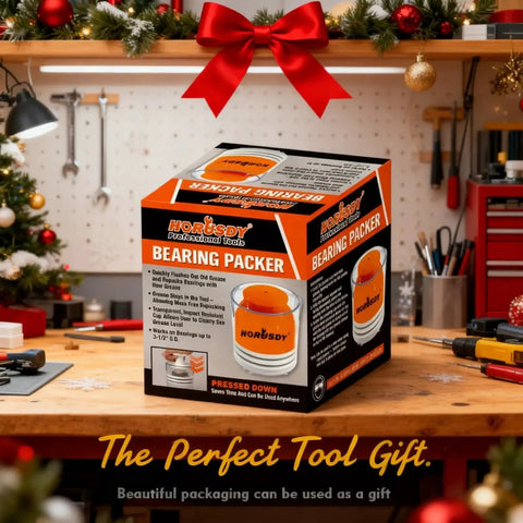 Box of Premium Wheel Bearing Packer Tool Kit With Self Contained Piston on workshop table with festive decorations.