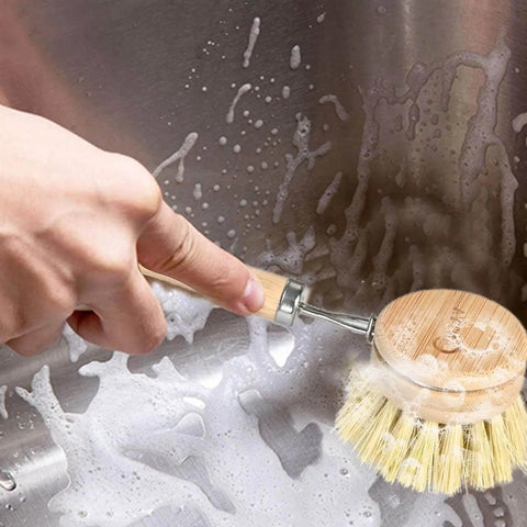 Bamboo dish brush set with handle plus 4 replacement heads used for scrubbing kitchen sink with compostable sisal bristles