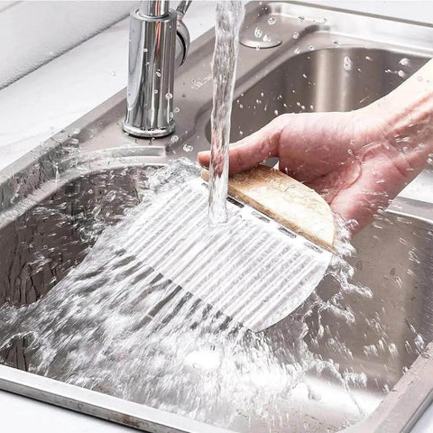 Washing a crinkle cutter for veggies and potatoes stainless steel wave knife for chips and fries in a kitchen sink