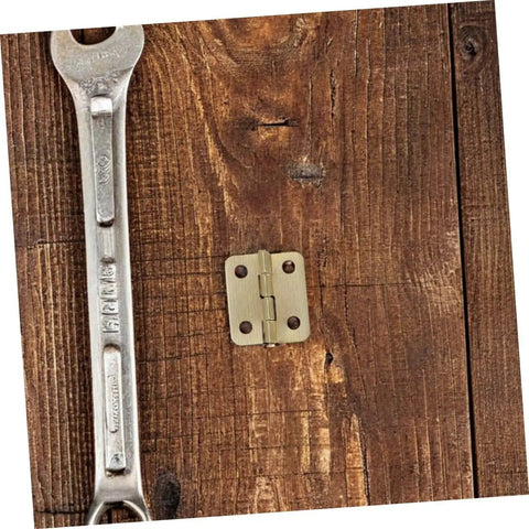 40 Pcs Miniature Brass Hinges With Screws For Jewelry Boxes And Dollhouses 270 Degree Tiny Hinge Hardware shown on wood
