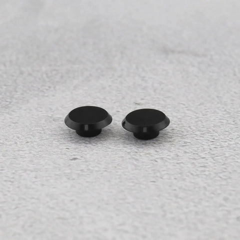 Black 50 Pack Socket Head Screw Cover Caps For M6 Allen Screws on gray surface, durable plastic for indoor and outdoor use