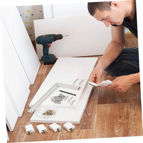 Man assembling furniture with versatile cotter pin clips set for trailer hitches and equipment, spring fasteners visible.