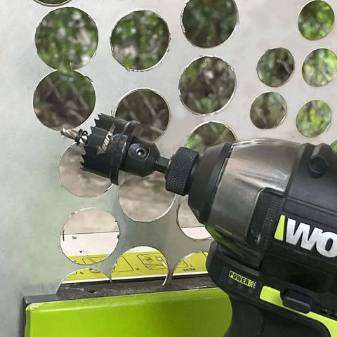 Beefy Bi-Metal Hole Saw Kit 3-Piece Set 7/8 To 1-3/8 Inch M42 Cobalt Teeth With Arbors mounted on drill cutting metal