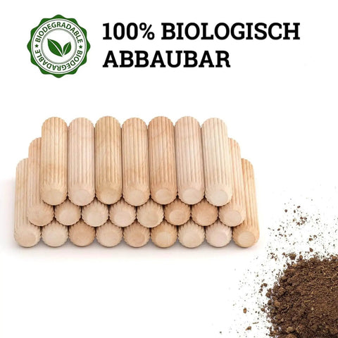 Stack of dowel pins one quarter inch by one and a half inch fluted hardwood pegs with soil, showing biodegradable label.