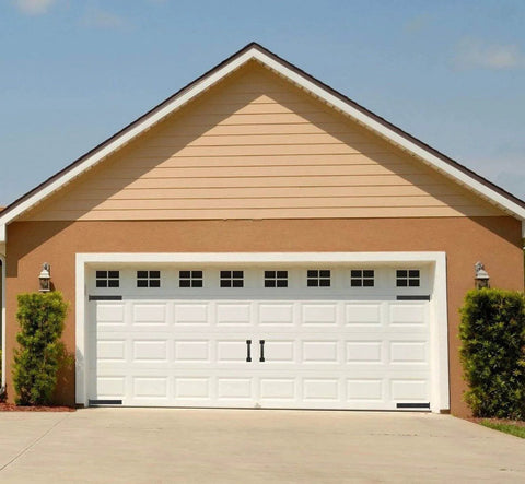 Six Piece Garage Door Magnetic Decorative Hardware Kit Featuring Four Rectangle Hinge Magnets And Two Handles In Black installed on white door