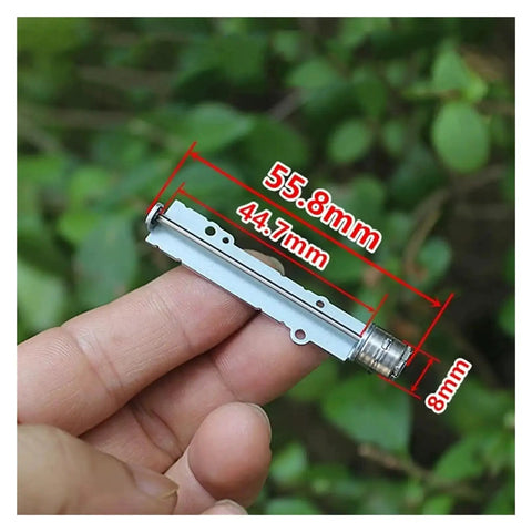 Close-up of 55.8mm Precision Screw Slide Stepper Actuator, DC 5V 2 Phase 4 Wire Long Linear Motor held between fingers.