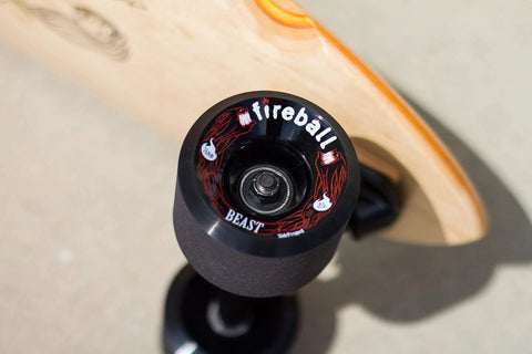 Fireball Dragon inline skate bearing, black with red dragon artwork, inner bearing visible