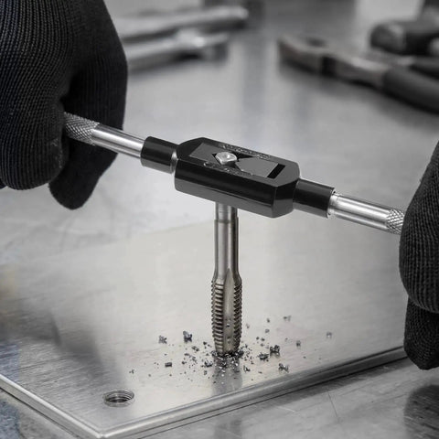 Using 51-Piece SAE Tap And Die Set For Threading And Rethreading 1/4 To 1 Inch Coarse And Fine Thread Taps on metal plate