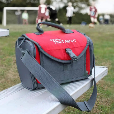 All In One Sports Coach First Aid Kit In A Durable Duffel Bag With 189 Pieces on bench during soccer practice