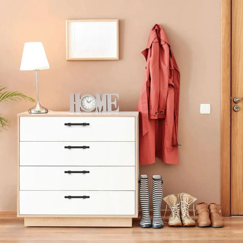 White dresser with Matte Black Cabinet Pulls 30 Pack Stainless Steel 3 Inch Center To Center Drawer Handles, lamp, and coat in room.