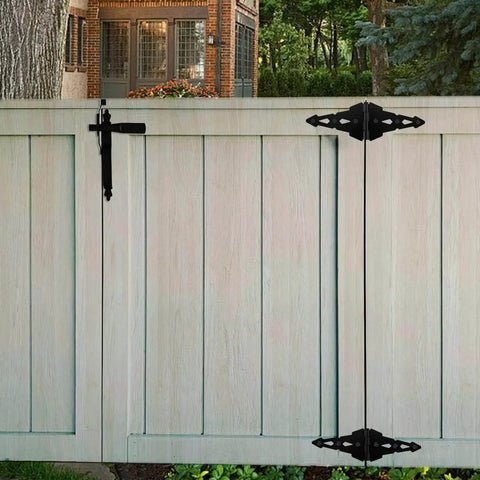 Outdoor wooden fence featuring black hinges from 8 Inch Heavy Duty Gate Hinges For Wood Gates And Fences Black Six Pack With Screws And Mounting Hardware.
