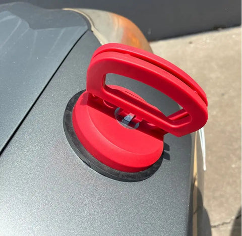 Double Handle Car Dent Lifter With Locking Suction Plate 4 Inch Diameter Vacuum Dent Puller on a car hood