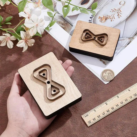 Leather Cutting Die Set 2 Piece 2 Styles With Wooden Die Molds Sharp Steel Blades Wallet Punching Dies And DIY Craft Stamping Tool On Smooth Wooden Base displayed on a table with a ruler and flowers