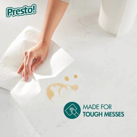 Hand using Ultra-Strong Premium Paper Towels With 158-Sheet 2-Ply Huge Roll, Flex-A-Size Design to clean a spill.