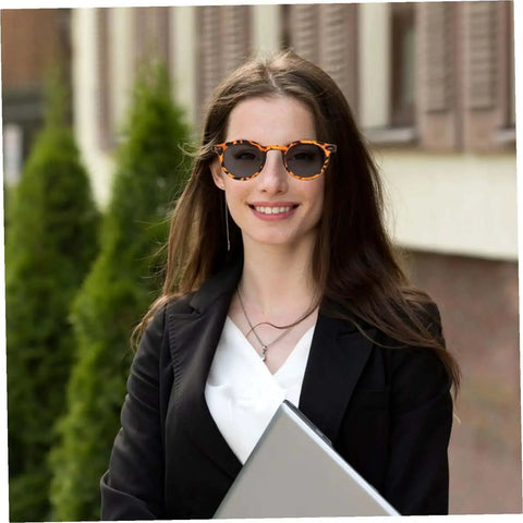 Woman wearing outdoor sports sunglasses for men and women with UV protective lenses, ergonomic frame, non-slip temple tips.