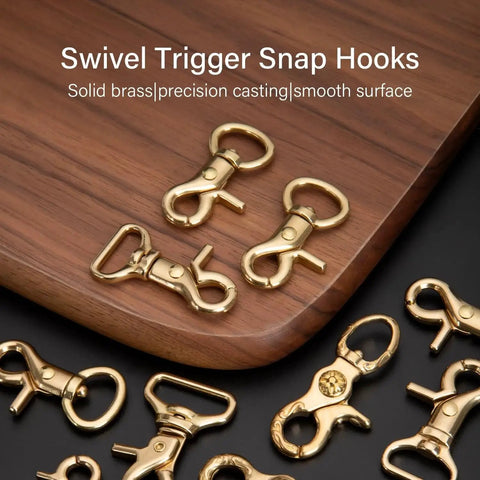 Solid Brass Trigger Snap Hooks Lobster Clasps Swivel Straps Bags Leathercraft displayed on wooden surface