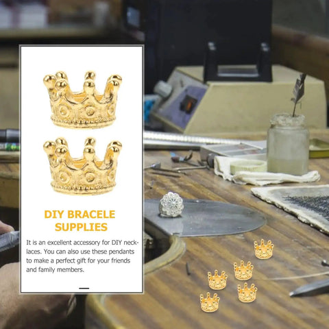 Dope Vintage Style Crown Charms Set, 50 Pcs Alloy Gold Tone Crown Pendants in a jewelry workshop.