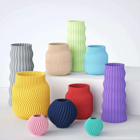 Various wavy vases 3D printed in vibrant colors using Matte PLA Filament Bundle 4kg 1.75mm for FDM Printers.