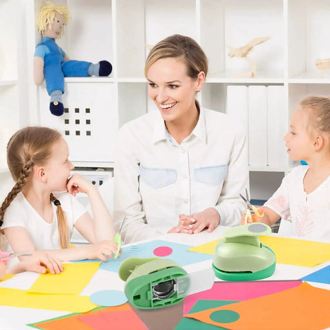 Teacher with students using Circle Punch Set for crafting. Circle punch tools in 3 inches, 2 in, 1.5 in, and 1 in sizes on table.
