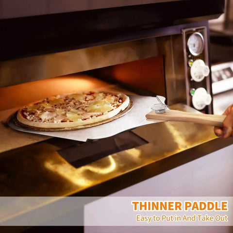 Pizza Peel And Rocker Cutter Set For Home Kitchen With Aluminum Paddle 12 By 14 Inches in use, placing pizza into oven