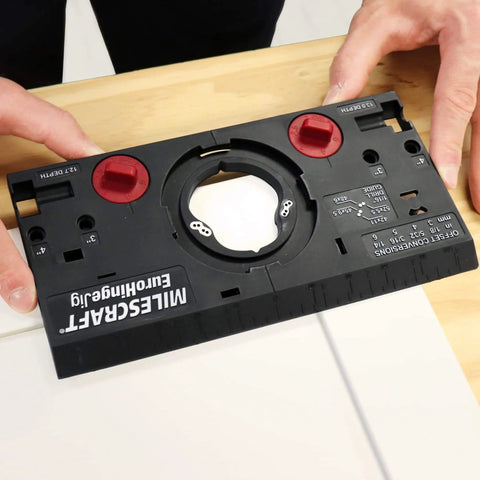 Concealed Cabinet Hinge Jig With 35 Mm Forstner Bit And Metal Bushing Drill Guide showing edge alignment features on a table.