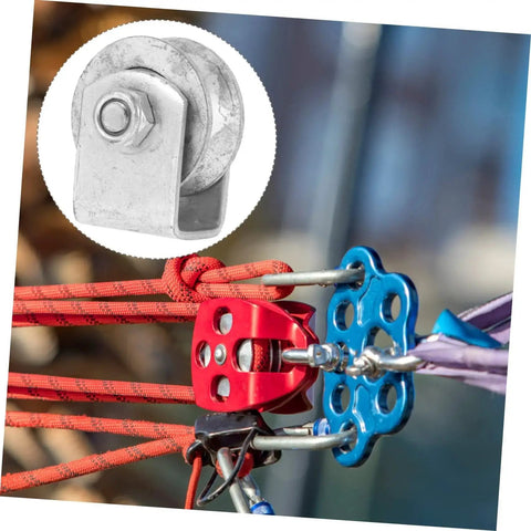 Close-up of Beefy Heavy Duty Cast Iron V Groove Wheel Pulley for sliding gates and ropes setup on industrial rigging equipment