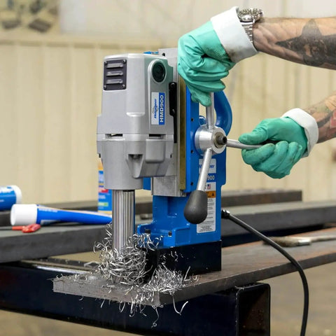 Worker using Powerful Magnetic Drill HMD900 115V With 1.5 By 2 Inch Capacity, Hidden Cord, Ergonomic Housing, Spring Slug Ejection