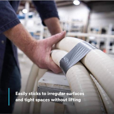 Heavy Duty Duct Tape, Silver, 1 Pack, used for bundling hoses in an industrial setting, showing its sealing capability.