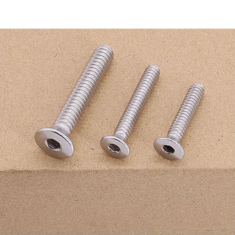 Three 1/4-20 Flat Socket Cap Screws, 2-1/2 Inch Long, Full Thread, Countersunk Head, 304 Stainless Steel 18-8, displayed side-by-side