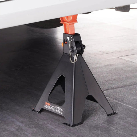 6 Ton Jack Stands With Double Locking Adjustable 14.2 To 23 Inches For SUV UTV under a vehicle, side view in garage setting.
