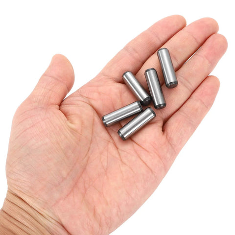 Hand holding Five Sixteenth Inch Dowel Pins, One Inch Length, Heat Treated Alloy Steel For Extra Hardness, Bright Finish, Precise Alignment, Rust Resistant, Built To Last, Tough As Nails, 20 Pieces.