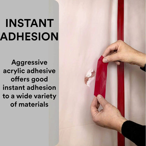 Person applying Construction Seaming Tape 8087CW, 1 Roll Red, 72 mm x 50 m to seal moisture barrier with acrylic adhesive.