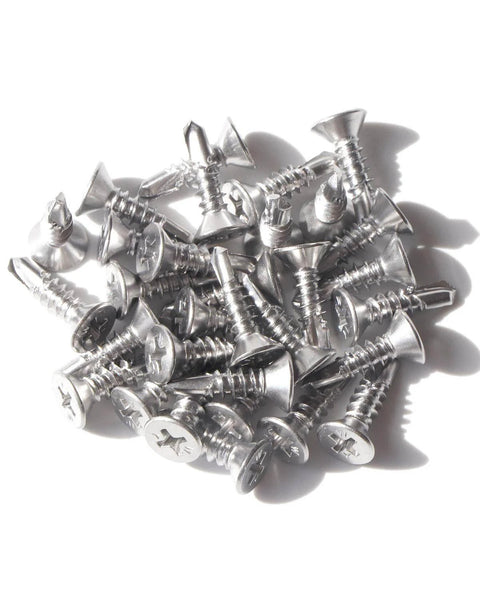 Pile of Self Drilling Tek Screws Number Ten By Three Quarters Inch 410 Stainless Steel Flat Head Phillips Sheet Metal Fasteners