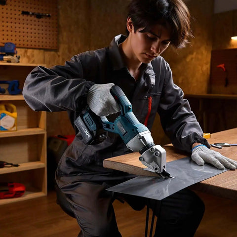 Person using Workhorse Cordless Sheet Metal Cutter with 360 Degree Pivoting Head and Double Blades on metal sheet in workshop