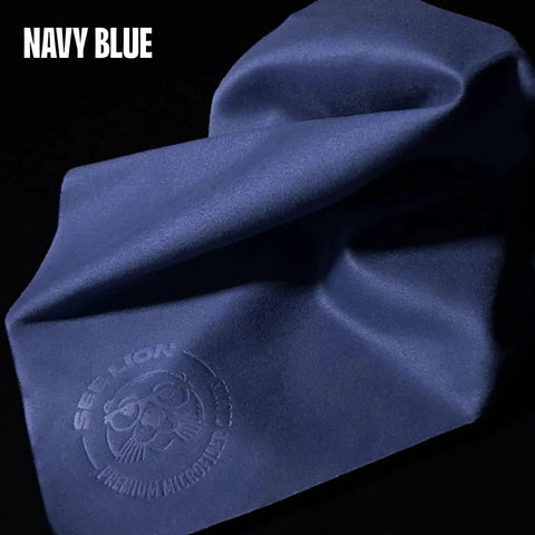 Navy blue Ultrasoft Microfiber Lens Cleaning Cloths for Glasses and Screens 6 Pack, showing close-up of material texture and embossed logo.
